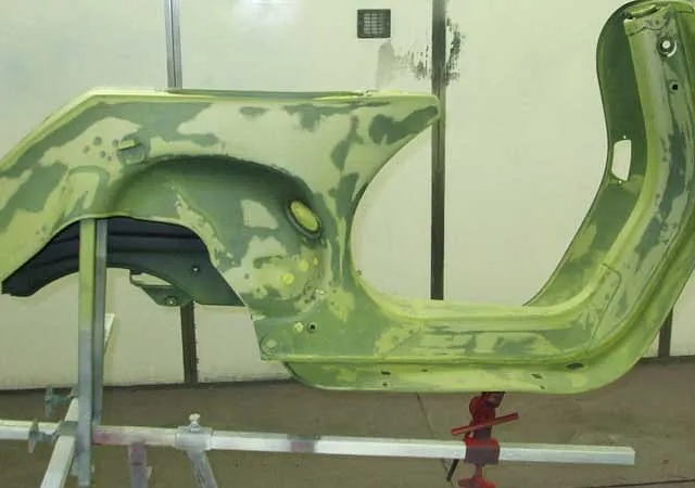 A scooter that is getting ready for paint